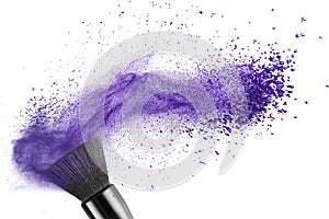 Makeup brush with blue powder isolated