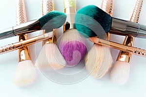 Makeup brush cosmetics on a white background