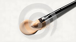 Makeup brush with foundation on a white background. Close-up.
