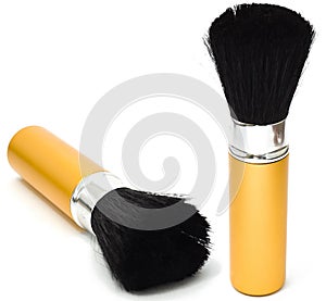 Makeup brush of gold color