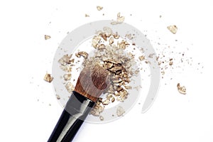 Makeup brush with gold eyeshadows