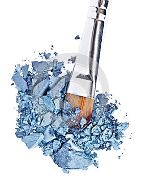 Makeup brush with grey blue crushed eye shadow
