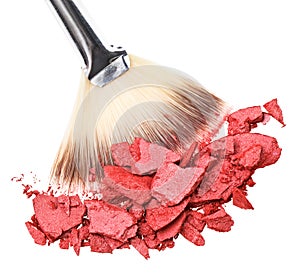 Makeup brush with red crushed eye shadow