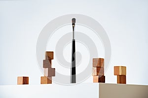 makeup brush and wooden cubes on white background