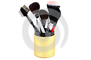 Makeup brushes in a container