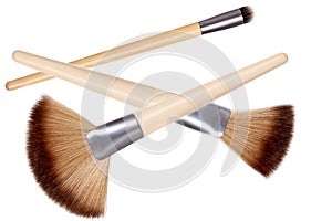 Makeup brushes isolated. Collage set of three new wooden professional make up brushes isolated on a white background. Concept