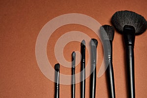 makeup brushes mascara accessories glamor brown background