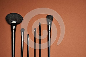 makeup brushes mascara accessories glamor brown background