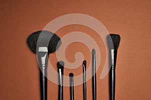 makeup brushes mascara accessories glamor brown background