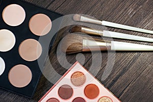 Makeup brushes and makeup products on the table