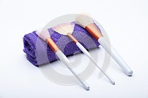 Makeup Brushes on purple towel
