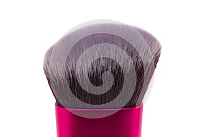 Makeup brushes. Selective focus on an elegant pink black professional make-up brush isolated on a white background. Concept beauty