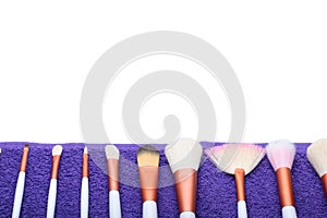 Makeup Brushes set on purple towel