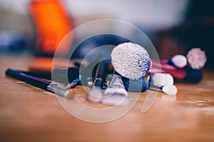 makeup brushes on a wooden table