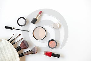 Makeup cosmetics tools background and beauty cosmetics, products and facial cosmetics package lipstick, eye shadow on the white ba photo