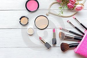 Makeup cosmetics tools background and beauty cosmetics, products and facial cosmetics package lipstick, eyeshadow with rose and pe photo