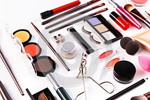 Makeup cosmetics tools and essentials, flat lay on white background