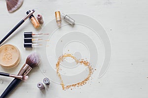 Makeup Cosmetics on White Wooden Background