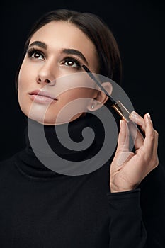 Makeup Cosmetics. Woman With Beauty Face Applying Black Mascara