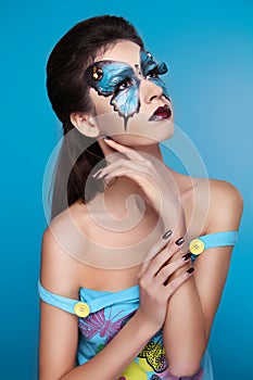 Makeup. Fashion face art portrait. Beautiful model girl posing