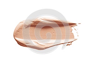 Makeup foundation, concealer swatch smudge smear isolated on white background. Nude make up base brushstroke, swipe