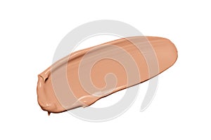 Makeup foundation texture, beige concealer swatch smudge smear isolated on white background. Nude makeup base swipe photo