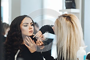 Makeup and hairstyle for a beautiful model