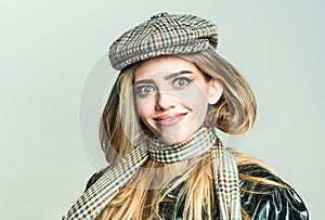 Makeup look for woman with soft skin. Autumn fashion for woman in hat and scarf. Trendy girl with makeup on sensual face