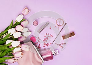 Makeup products with cosmetic bag and flowers