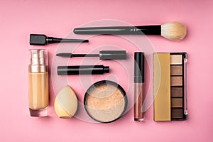 Makeup professional cosmetic beauty products on pink background