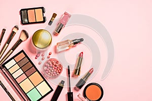 Makeup professional cosmetics on pink background.