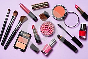 Makeup professional cosmetics on purple background.