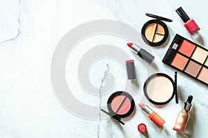 Makeup professional cosmetics on white marble background.