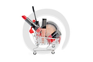 Makeup in pushcart isolated on white background. Red lipstick, mascara, pink lip gloss, powder, nail polish. Makeup