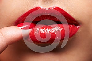 Makeup, red lipstick and closeup of woman lips with trendy, beauty and manicure treatment. Mouth, cosmetics and zoom of