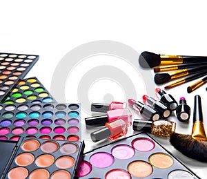 Makeup set palettes with colorful eyeshadows. Cosmetic brushes