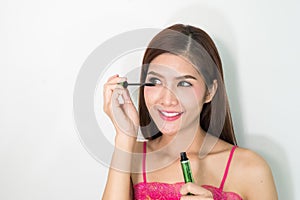 Makeup woman putting mascara eye make up on eyes. Asian fresh fa