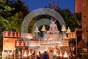 Makha Bucha Day.Traditional buddhist monks are lighting candles for religious ceremonies at Wat Phan Tao temple