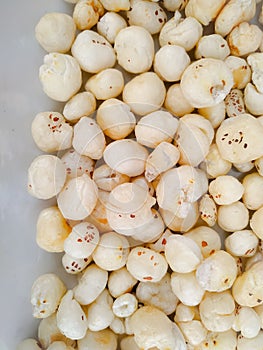 Makhana, also called as Lotus Seeds or Fox Nuts are popular dry snacks from India, isolate on white background