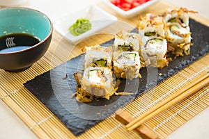 Maki roll with salmon, popular Japanese cuisine. Sushi roll with fish, cream cheese and vegetables