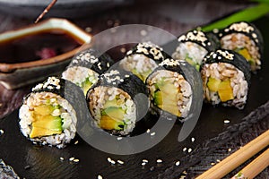 Maki rolls with avocado and unagi sauce. Sushi menu.
