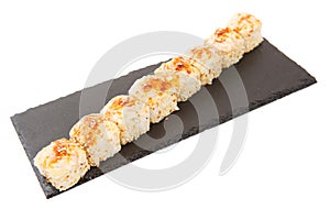 Maki Sushi - Roll made of Smoked Eel, Cream Cheese and Deep Fried Vegetables inside. Sushi isolated on shale food board on white