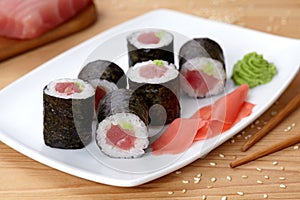 Maki sushi roll with tuna, wasabi, ginger and nori