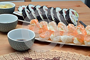 Maki sushi rolls and nigiri sushi japan food on the table and soy sauce