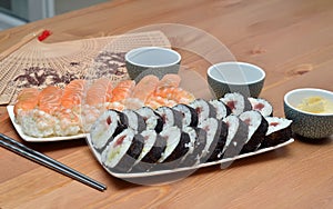 Maki sushi rolls and nigiri sushi on plate japan food on the table detail