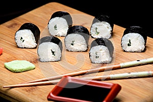 Maki Sushi with and spring onion inside.