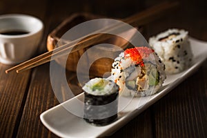 Maki sushi on a wooden table