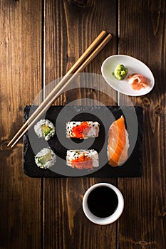 Maki sushi on a wooden table. Top view