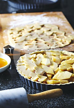 Making an apple pie from flaky pastry dough