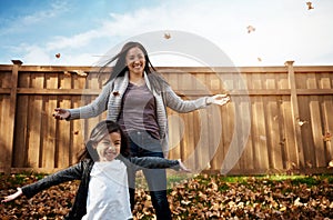 Making autumn memories with mom. an adorable little girl enjoying an autumn day outdoors.